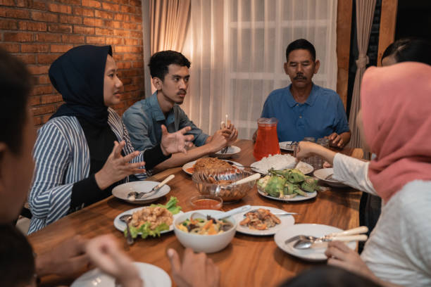 istock asian muslim family dinner together. break fasting 1147894117