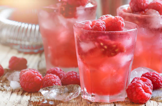 istock Cold Raspberry cocktail with ice, pink summer berry beverage, selective focus 1147899649