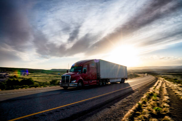 istock Long Haul Semi Truck on a Highway at Dusk under a Dramatic Sky 1147900848