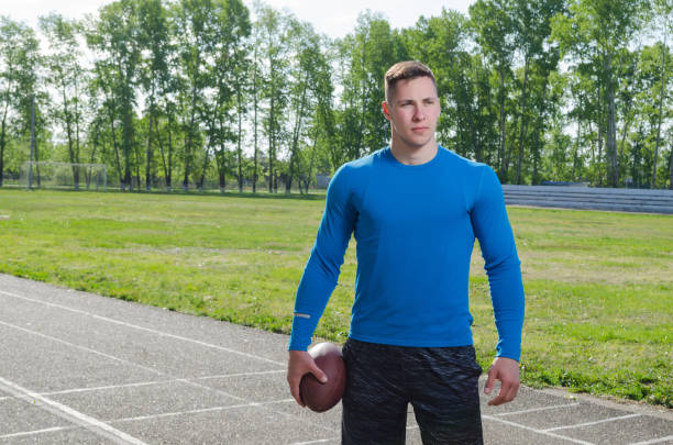 istock Young quarterback with the ball in training 1147903653