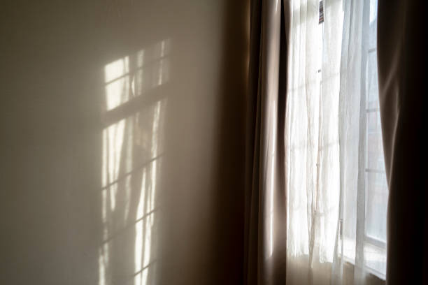 window,curtain and sunlight in morning