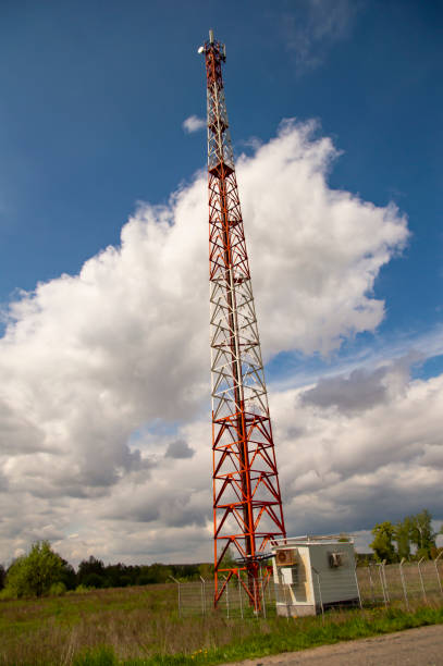 istock The tower of a mobile operator against the blue sky with white clouds 1147912824