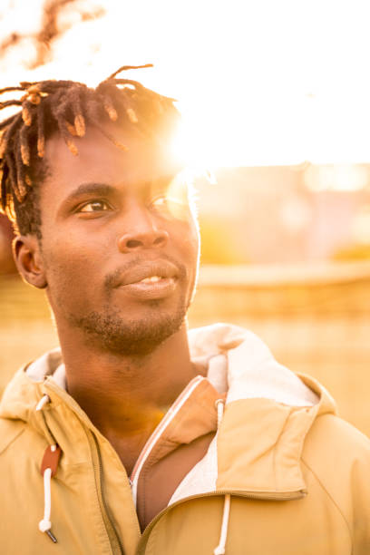 istock Young man in the city at sunset 1147913826