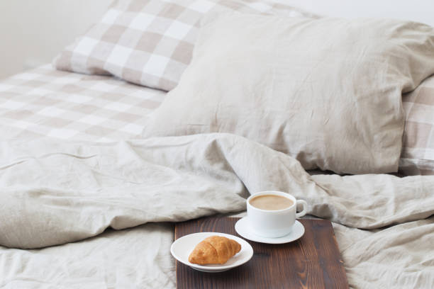 istock coffee on  tray on the bed in bedroom 1147914752