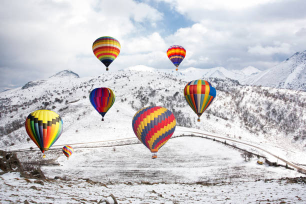 istock Air balloons on high snowy mountain 1147916787
