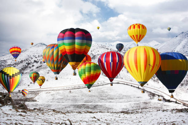 istock Air balloons on high snowy mountain 1147916823