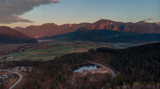 Aerial of Agassiz valley during sunrise Aerial of valley during golden hour shadow british columbia landscape cloudscape stock pictures, royalty-free photos & images