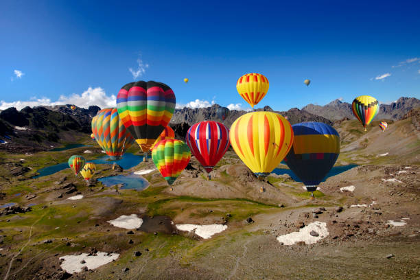 istock Air balloons on high snowy mountain 1147916903
