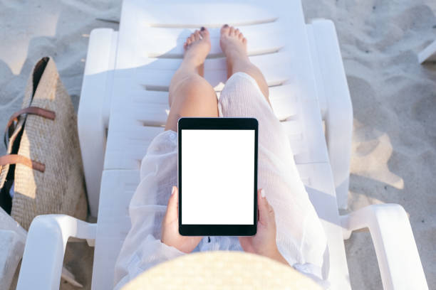 istock a woman holding and using a black tablet pc with blank desktop screen 1147917241