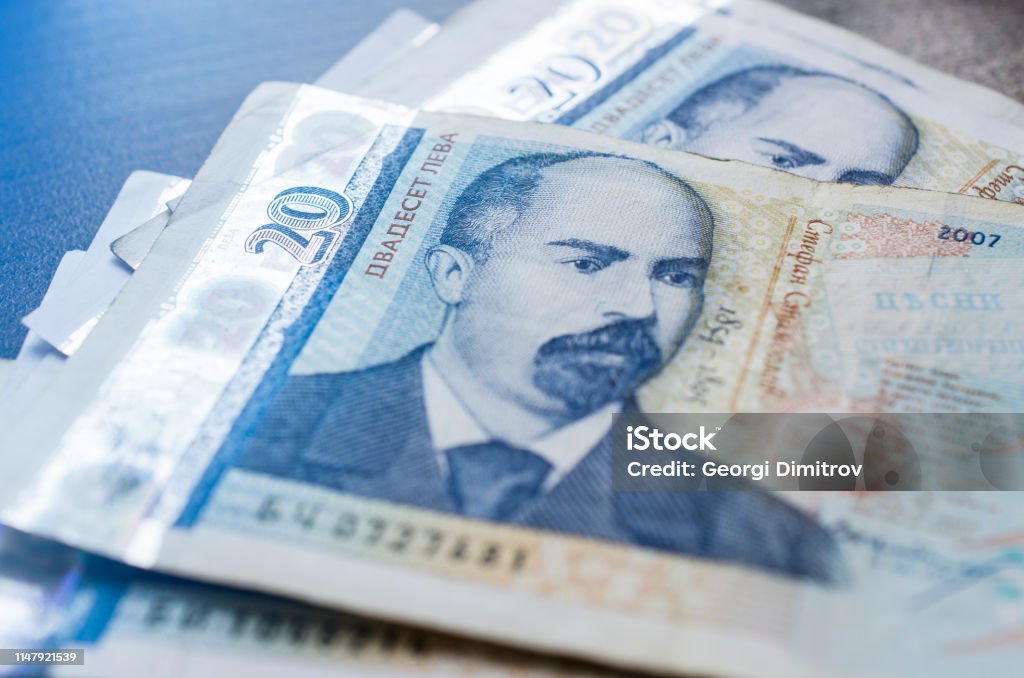 A man holding bulgarian banknotes with different curruncies. Macro close-up of bulgarian banknotes with different nomination. Bulgarian coins. Bulgarian Currency Stock Photo