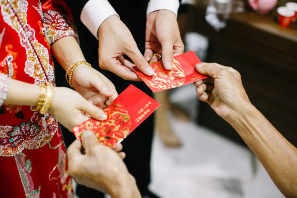 istock Elders giving red packet to newlywed couple 1147923507