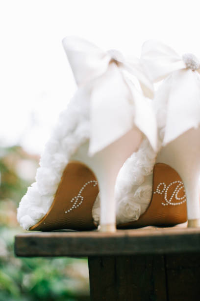 istock White wedding high heels with I Do wordings at bottom 1147923579