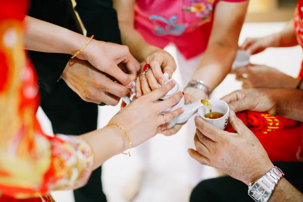 istock Newlywed serving tea to elder on Chinese traditional tea ceremony 1147923627