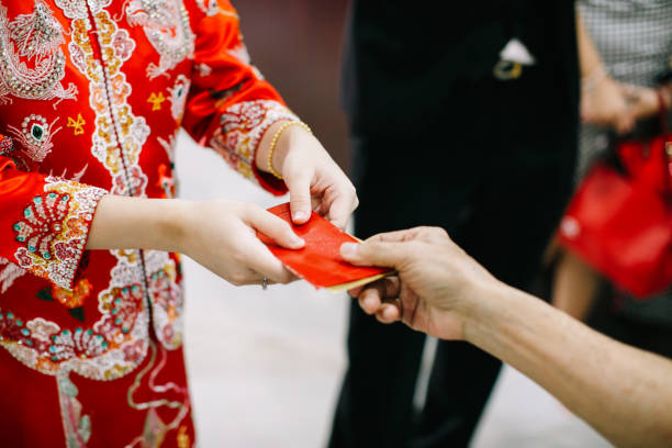 istock Elders giving red packet to newlywed couple 1147923854