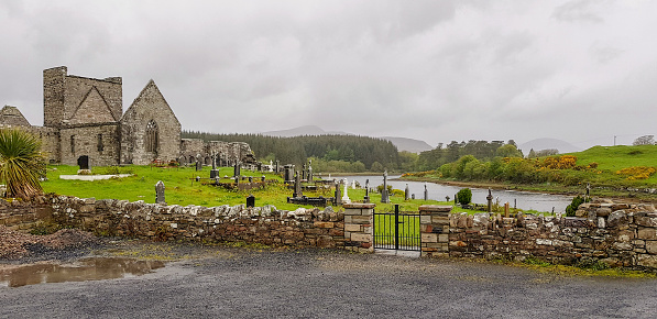 a old church ruin and graveyard seen in Connemara, a region in Ireland
