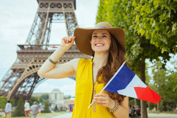 istock solo traveller woman with French flag exploring attractions 1147926051