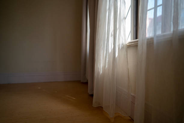 istock window,curtain and sunlight in morning 1147930034
