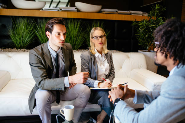 istock Financial advisor making presentation offer to clients at meeting 1147930105