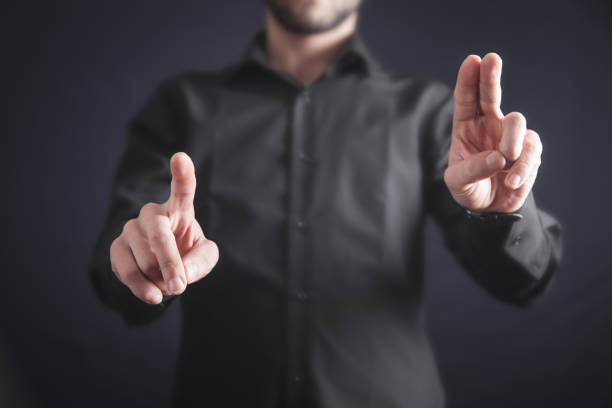 istock Businessman pointing or touching finger in screen. 1147931038
