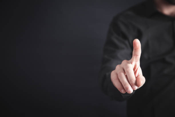 istock Businessman pointing or touching finger in screen. 1147931041