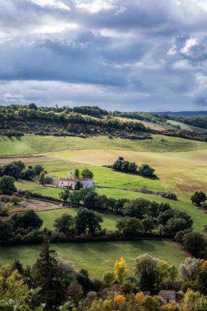 Farmhouse and rural landscape in regional France with overcast skies