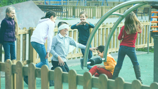 istock kids playing at Dead man in street 1147932949