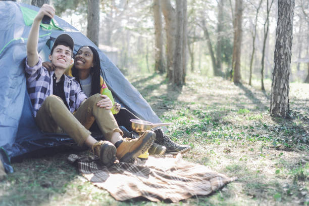 istock Mixed race couple camping 1147942487