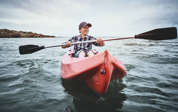 istock Teenage boy canoeing at sunset 1147942495