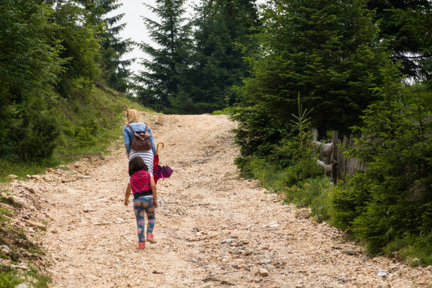 istock Mother and daughter in the springtime walk 1147944019