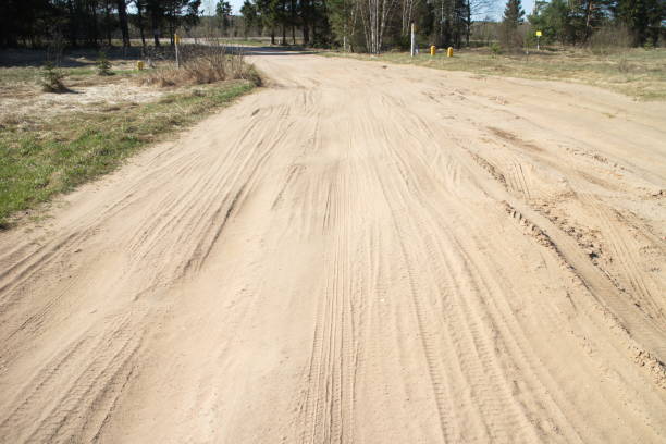 istock Spring country road on a sunny day 1147944307