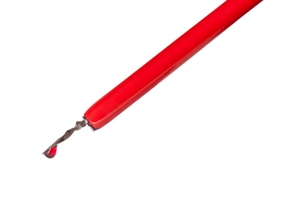 istock ink drop on tip of red nib pen close up 1147945831
