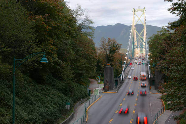 Blur motion of car driving on Lions Gate Bridge at Stanley Park in Vancouver BC Canada stock photo