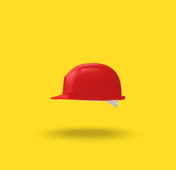 istock Red Helmet on Yellow Background, 3D Rendering 1147947244