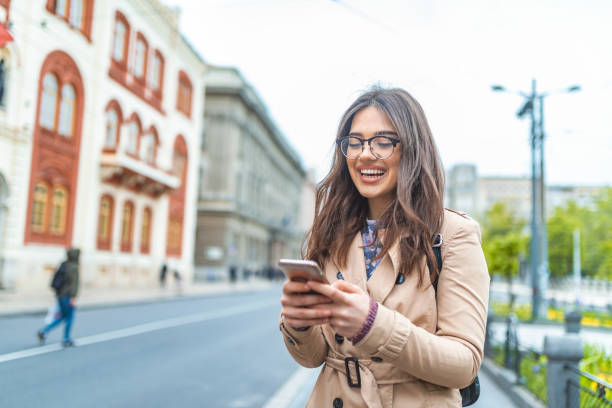 istock Beautiful young hipster woman using smart phone 1147947363