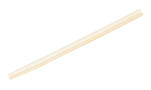istock carved disposable wooden chopsticks put together 1147950398