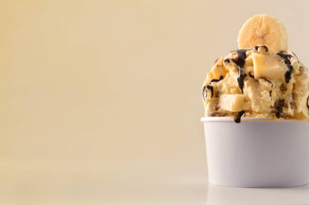 istock Banana ice cream cup on table isolated close up 1147950674