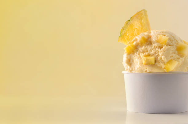 istock Pineapple ice cream cup on table isolated close up 1147950770