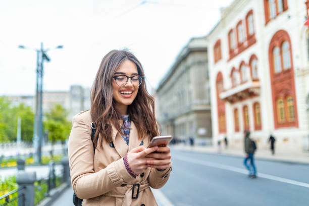 istock Beautiful woman texting on the mobile phone 1147950834