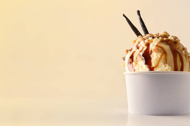 istock Vanilla ice cream cup on table isolated close up 1147950870