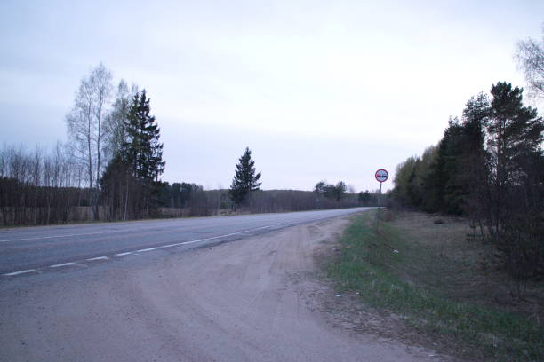 istock Spring country road in the evening 1147951822