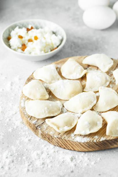istock uncooked cottage cheese dumplings on a board with flour 1147958608