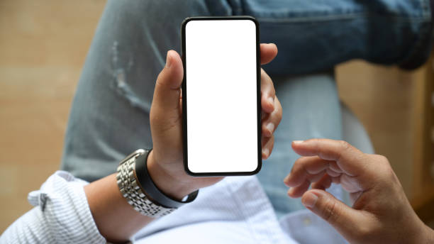 istock Top view man sitting and holding isolate screen of mobile phone 1147961809