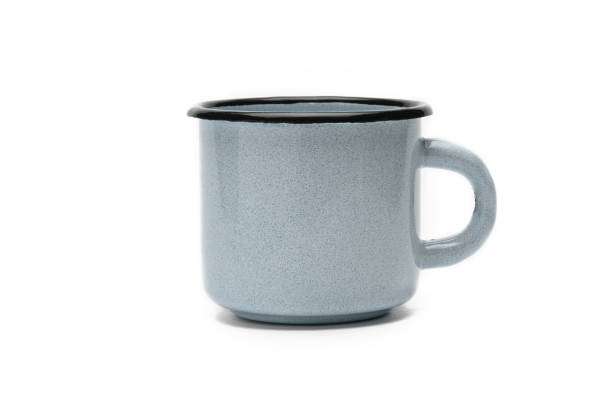 istock Old iron cup on a white background.Blue mug with black border 1147961926