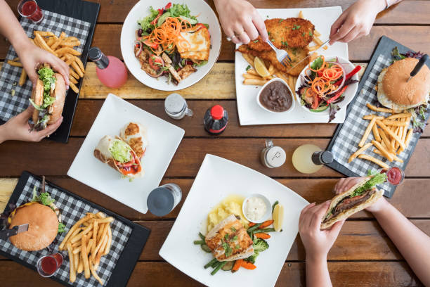 istock Beautiful Table with a big Brunch Spread with Girls Hands 1147962128