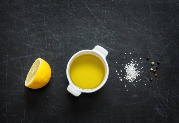istock Lemon vinaigrette dressing - recipe ingredients on black from above 1147962311