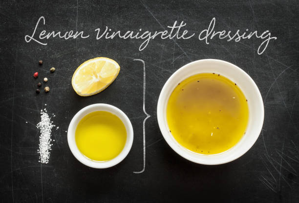 istock Lemon vinaigrette dressing - recipe ingredients on black from above 1147962312