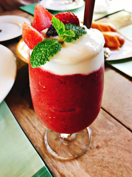 A glass of mixed berries yogurt smoothie.