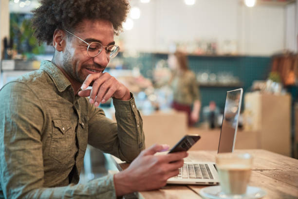 istock Young man looking at his finances in a mobile phone. 1147963286