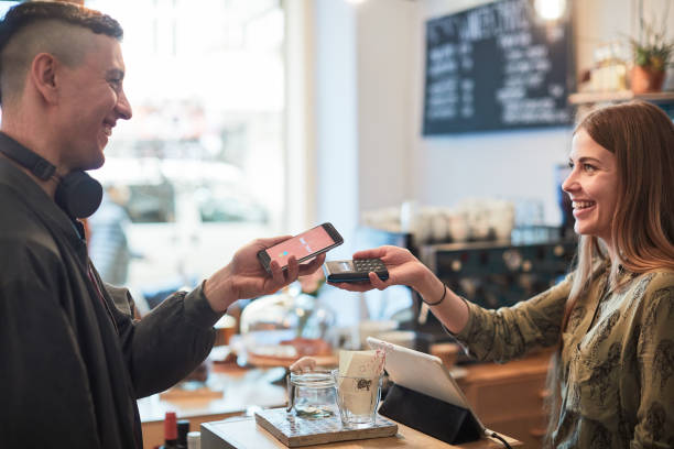 istock Contactless paying in a small business. 1147963299