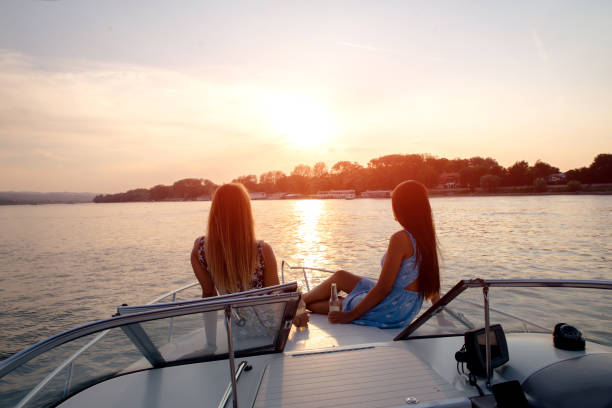 istock Girls are having drink on a boat 1147963369